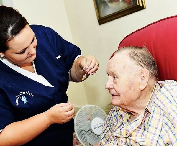 Resident receiving care from a caregiver