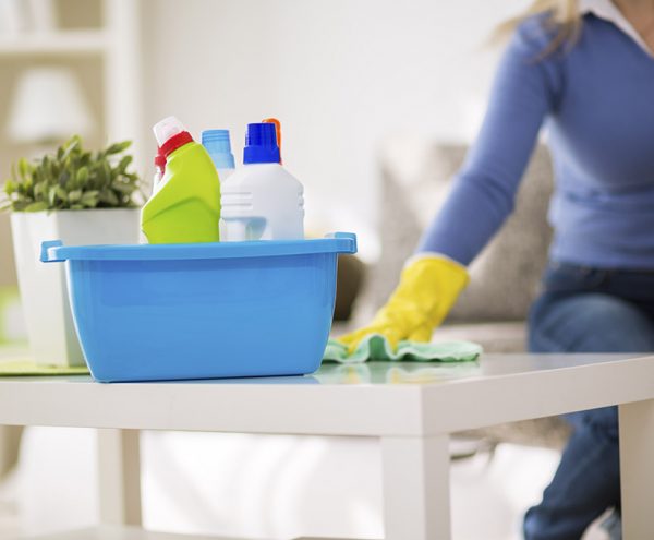 Someone cleaning a kitchen side