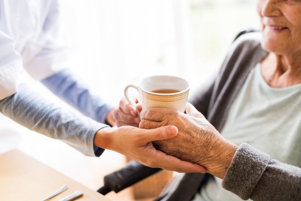 Elderly lady with cup of tea