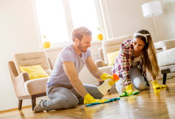 A couple performing Spring cleaning