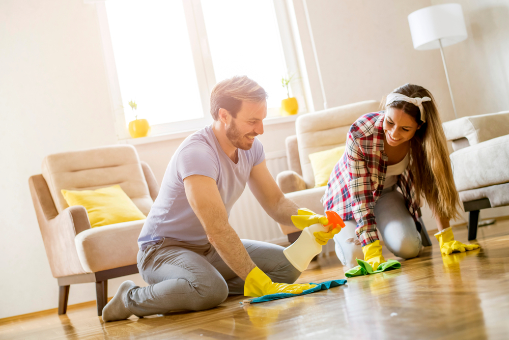 A couple performing Spring cleaning