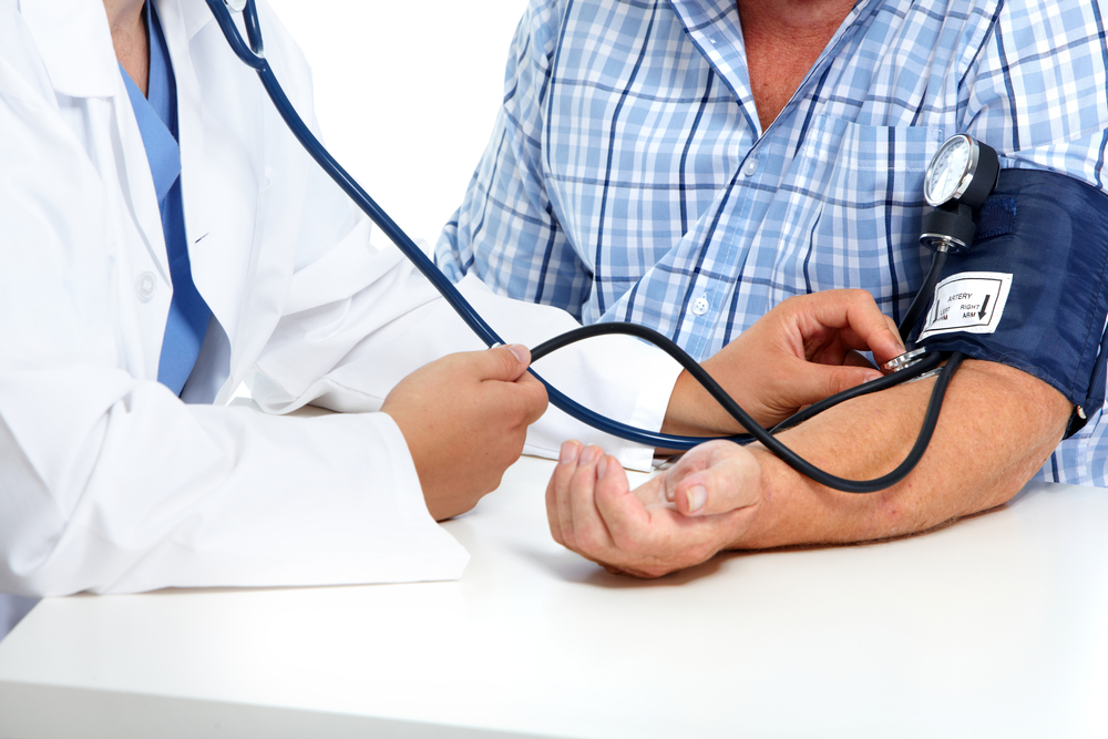 Doctor taking someone's blood pressure